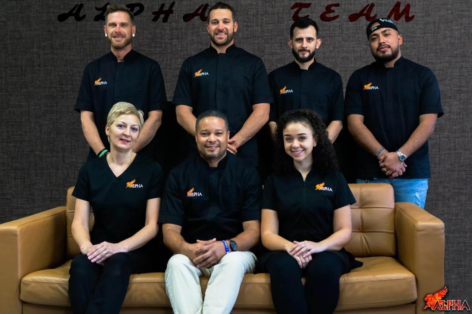 Group photo of the barbers and staff at ALPHA Men's Spa®